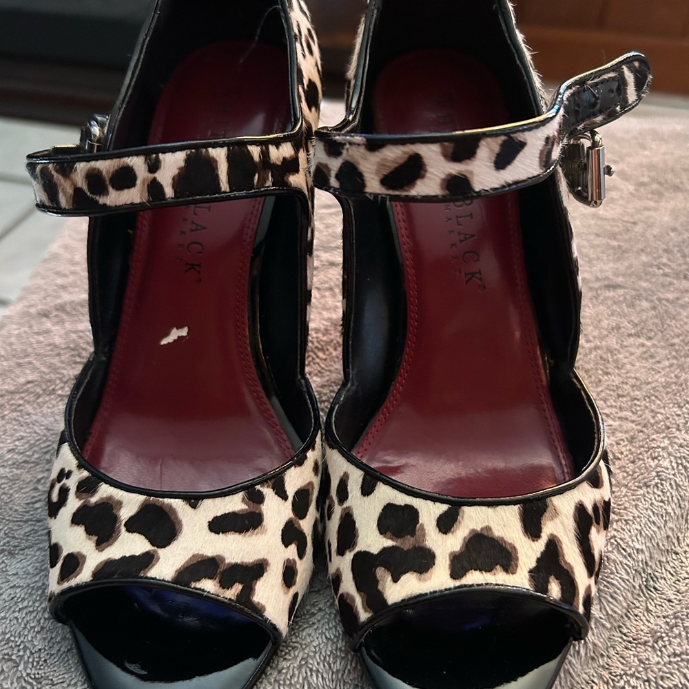 Beautiful open toe heels. Buckle strap. Approximately 3 inch heel.